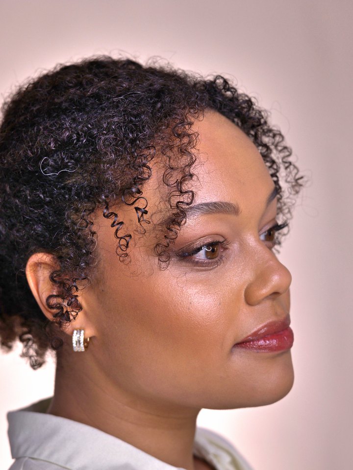 Bridal updo with curls and a soft red lip, side view — bridal makeup by Anja Zander